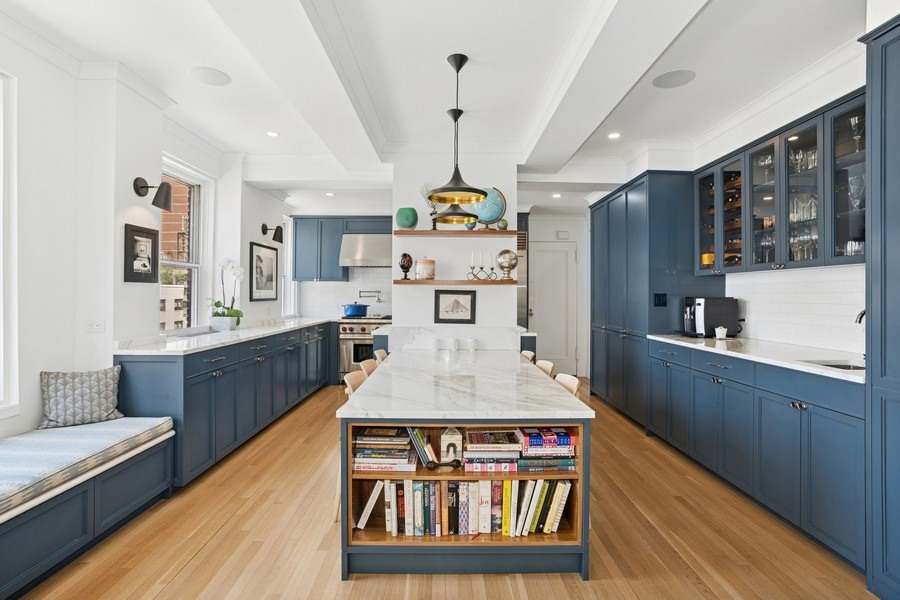350 East 57th Street, Unit 14B Manhattan, NY 10022 - Photo 6 of 14 a large kitchen with stainless steel appliances granite countertop a stove and cabinets