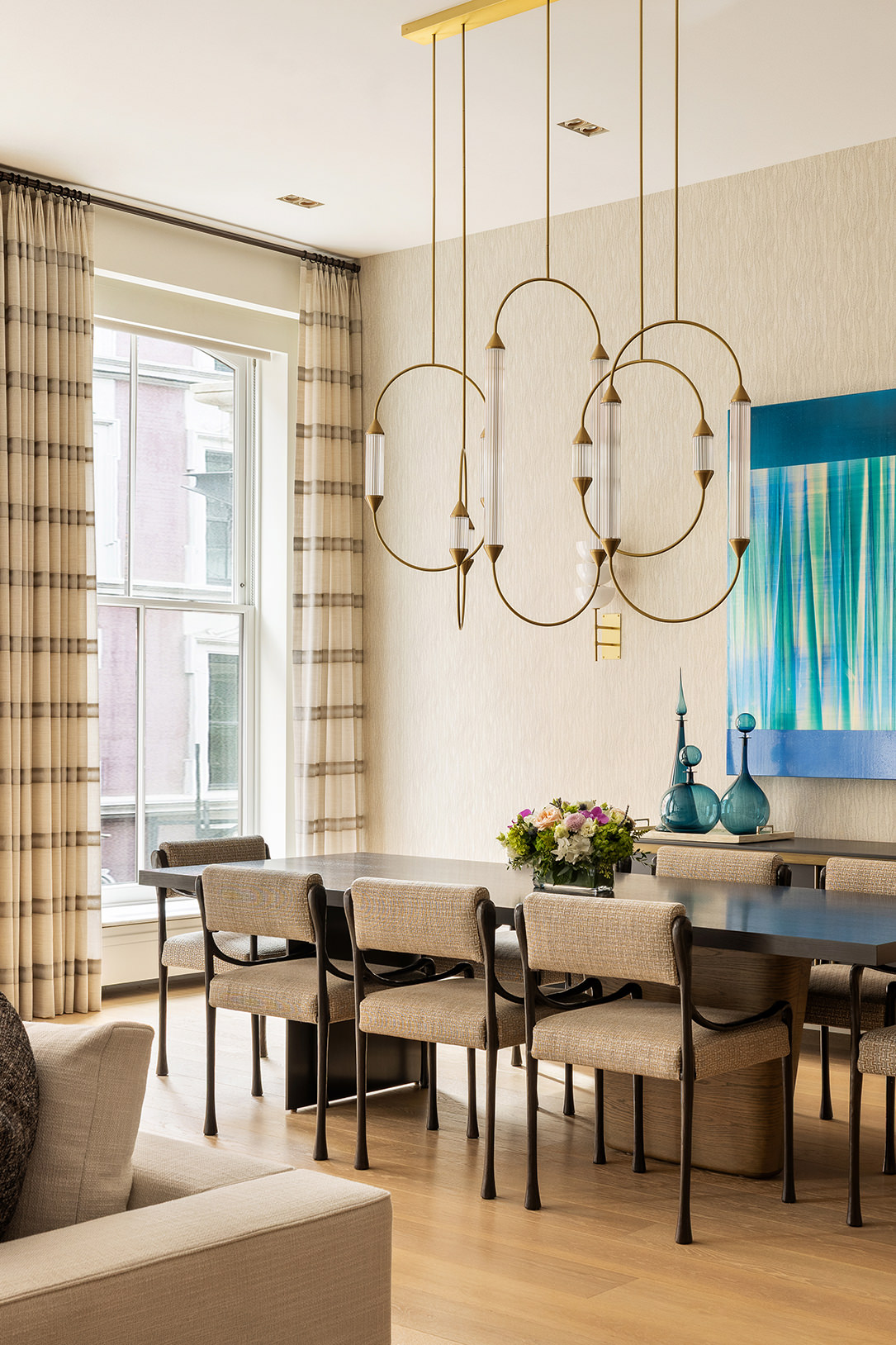 53 Greene Street, Unit 3 Manhattan, NY 10013 - Photo 6 of 22 a living room with furniture a table and a large window