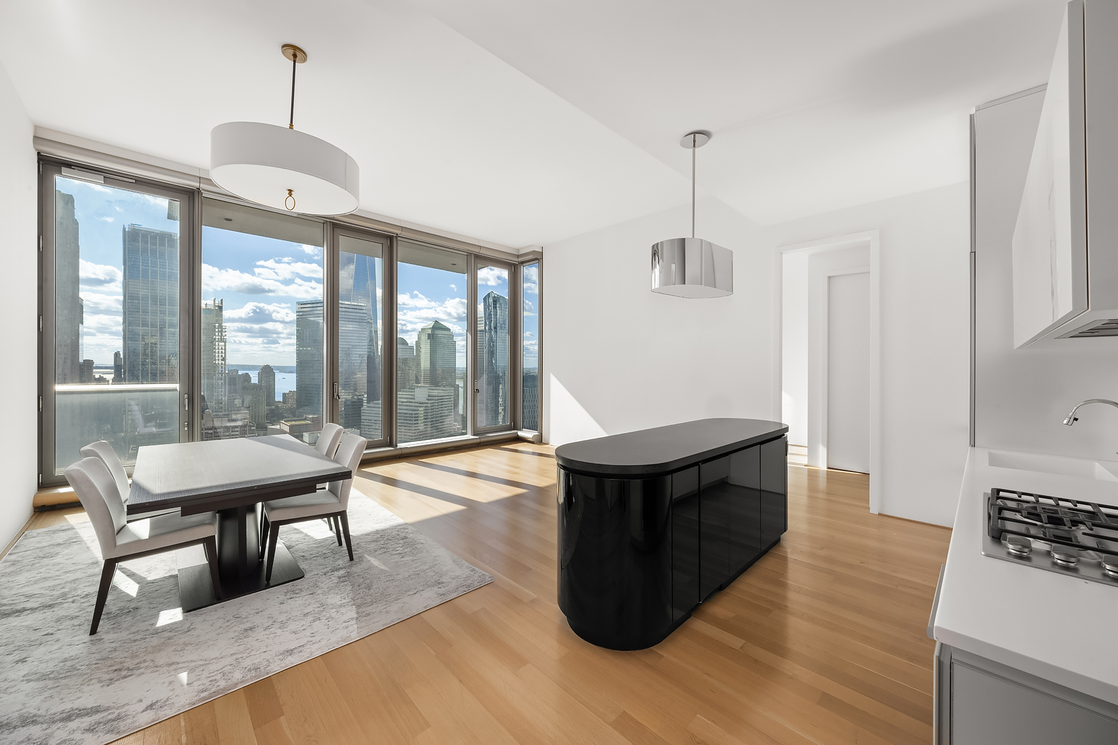 a living room with furniture a window and a dining table