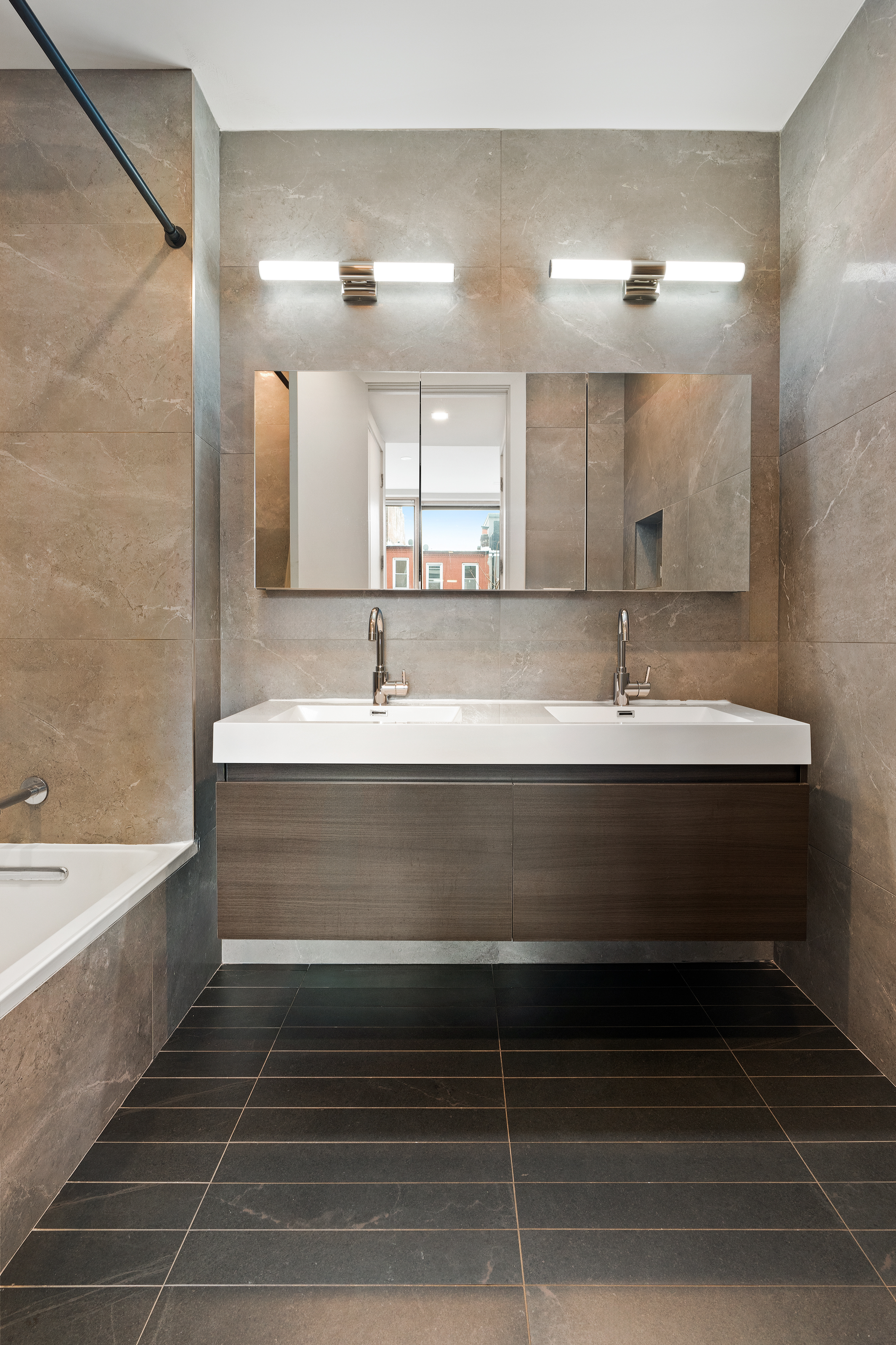 1230 Bedford Avenue, Unit 3R Brooklyn, NY 11216 - Photo 9 of 13 a bathroom with a double vanity sink mirror and bathtub