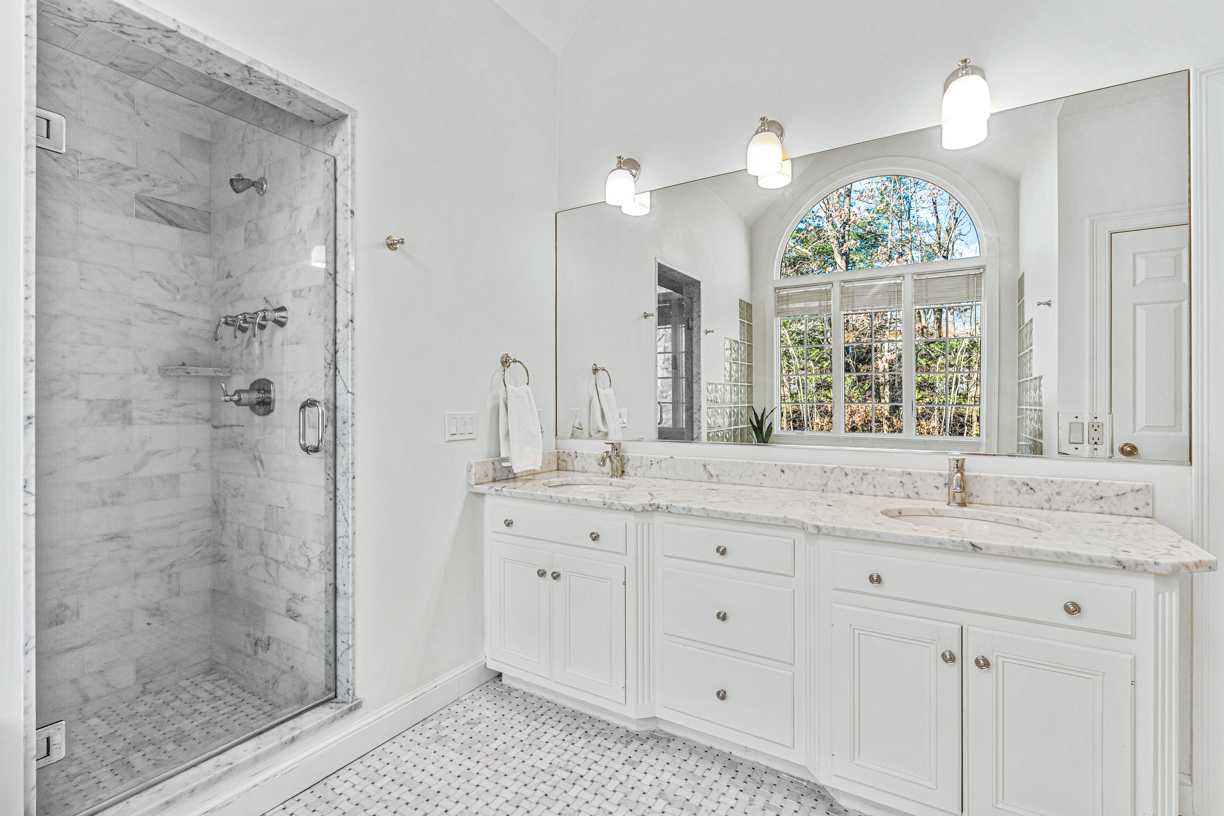 165 Bridle Trail Road Needham, MA 02492 - Photo 8 of 21 a bathroom with a granite countertop sink mirror and shower