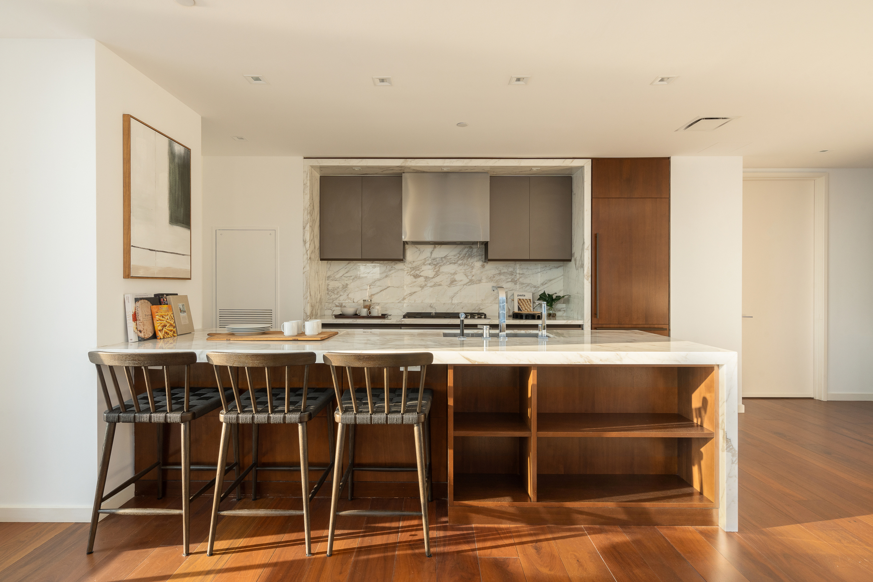1 West End Avenue, Unit 15J Manhattan, NY 10023 - Photo 4 of 20 a kitchen with a table chairs sink and cabinets