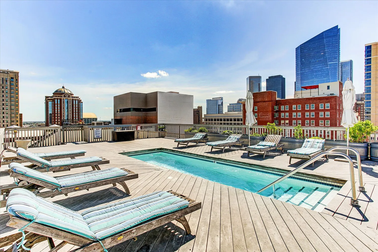 a living room with furniture and a book shelf