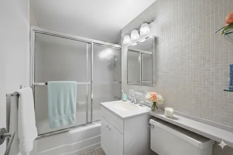 a bathroom with a sink and mirror