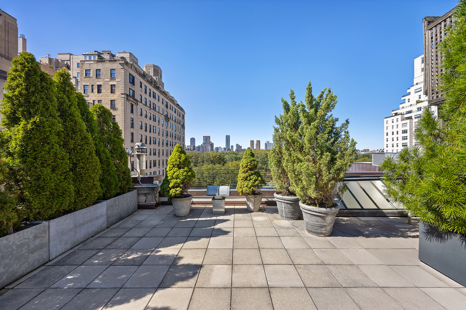 15 East 70th Street, Unit PHB Manhattan, NY 10021 - Photo 32 of 35 a view of a patio with couches and potted plants