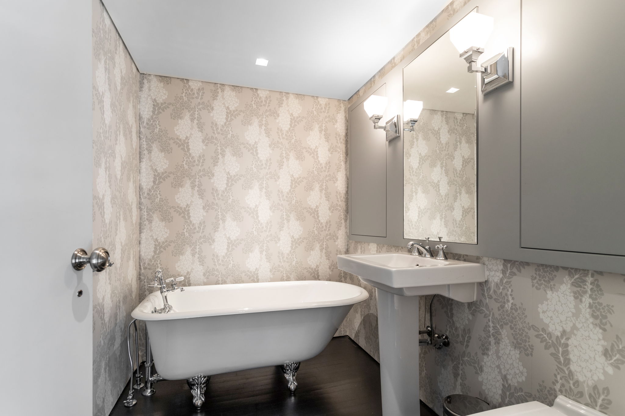 240 Centre Street, Unit 3H Manhattan, NY 10013 - Photo 12 of 20 a bathroom with a sink and a mirror