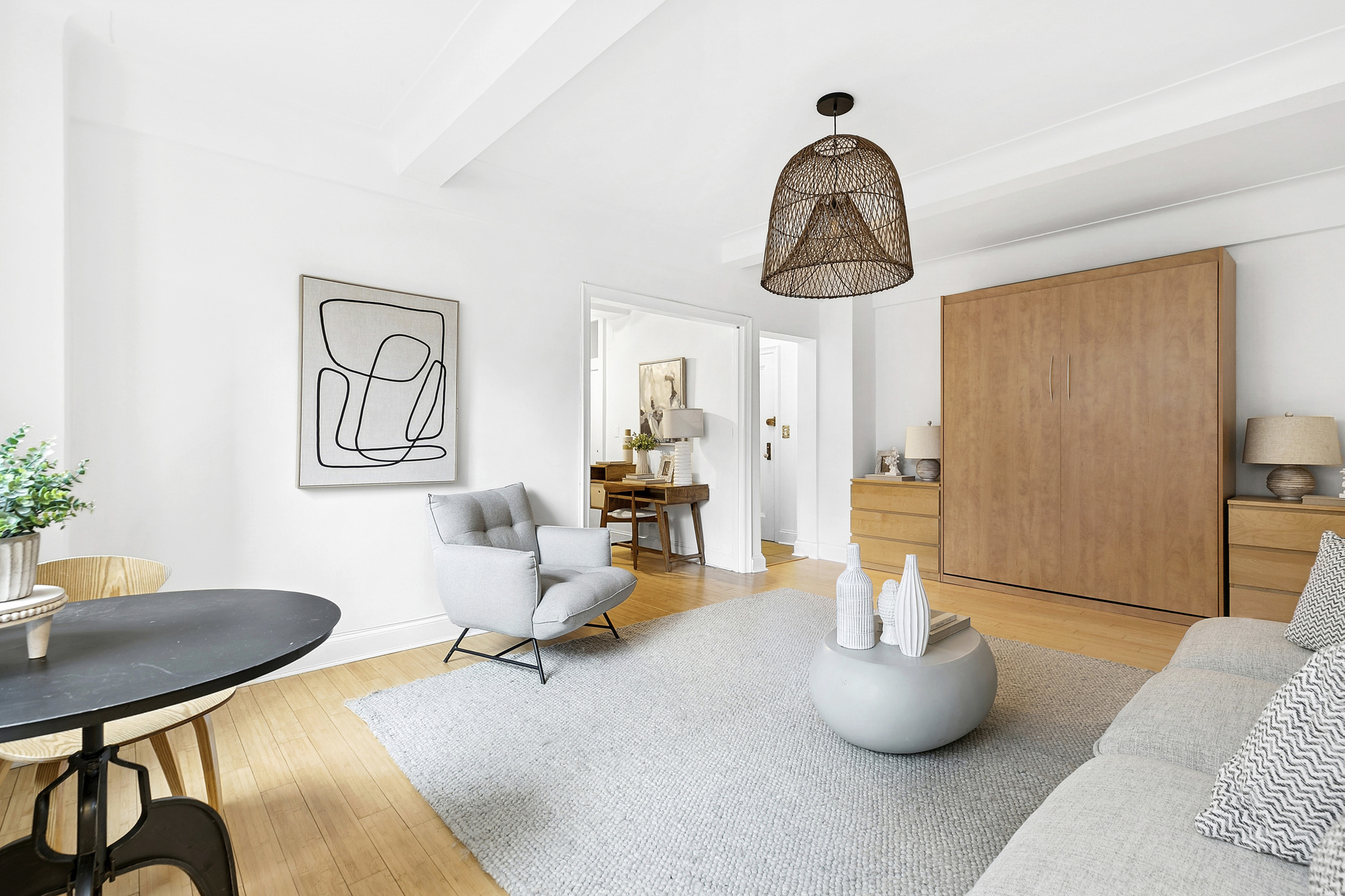235 East 22nd Street, Unit 4M Manhattan, NY 10010 - Photo 2 of 14 a living room with furniture and a window