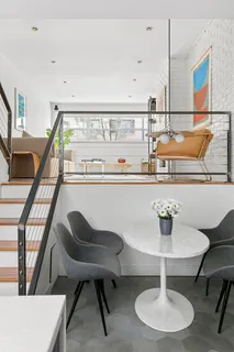 a living room with chairs