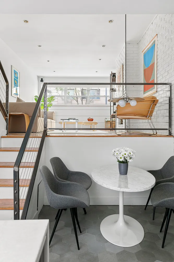 a living room with chairs