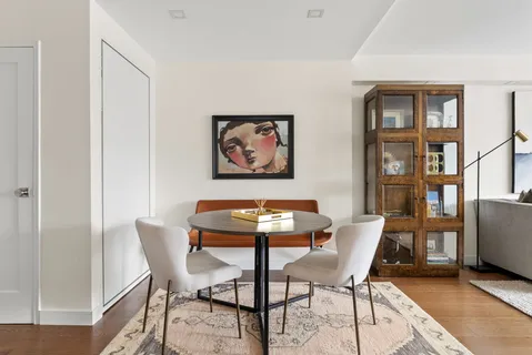 a dining room with furniture and window