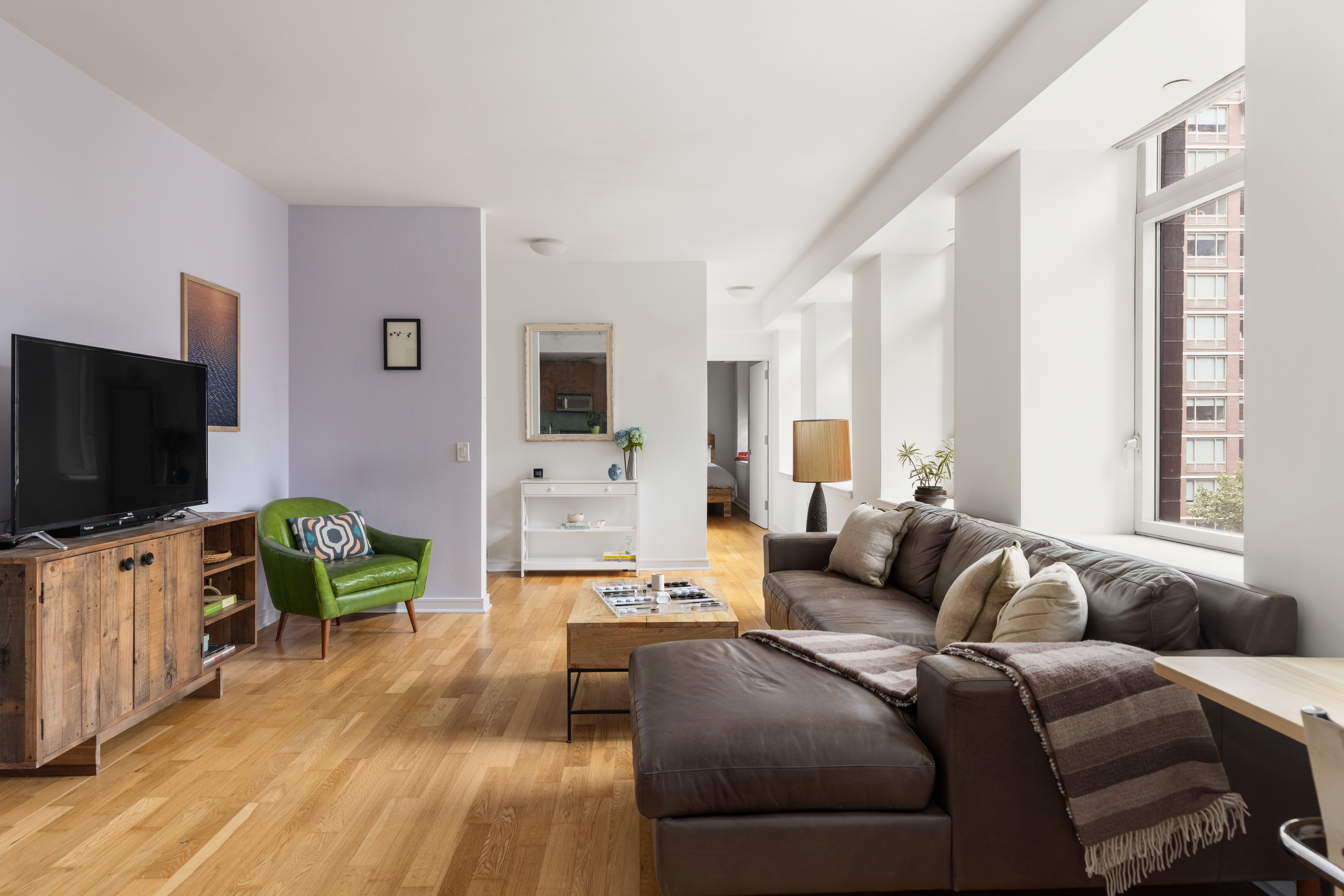 11 East 29th Street, Unit 7B Manhattan, NY 10016 - Photo 2 of 6 a living room with furniture and a flat screen tv