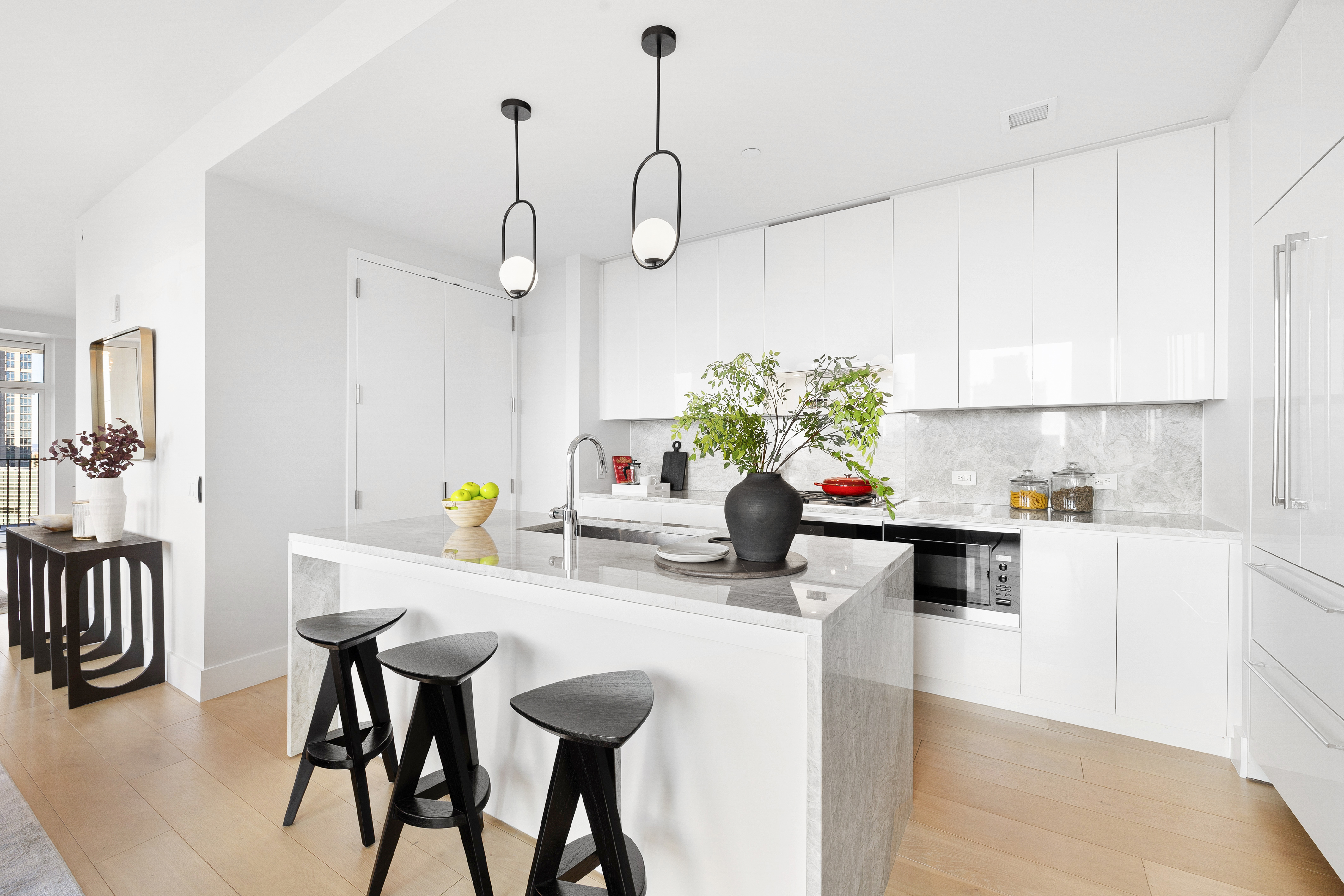 15 West 61st Street, Unit PH1C Manhattan, NY 10023 - Photo 8 of 26 a kitchen with a table and chairs in it