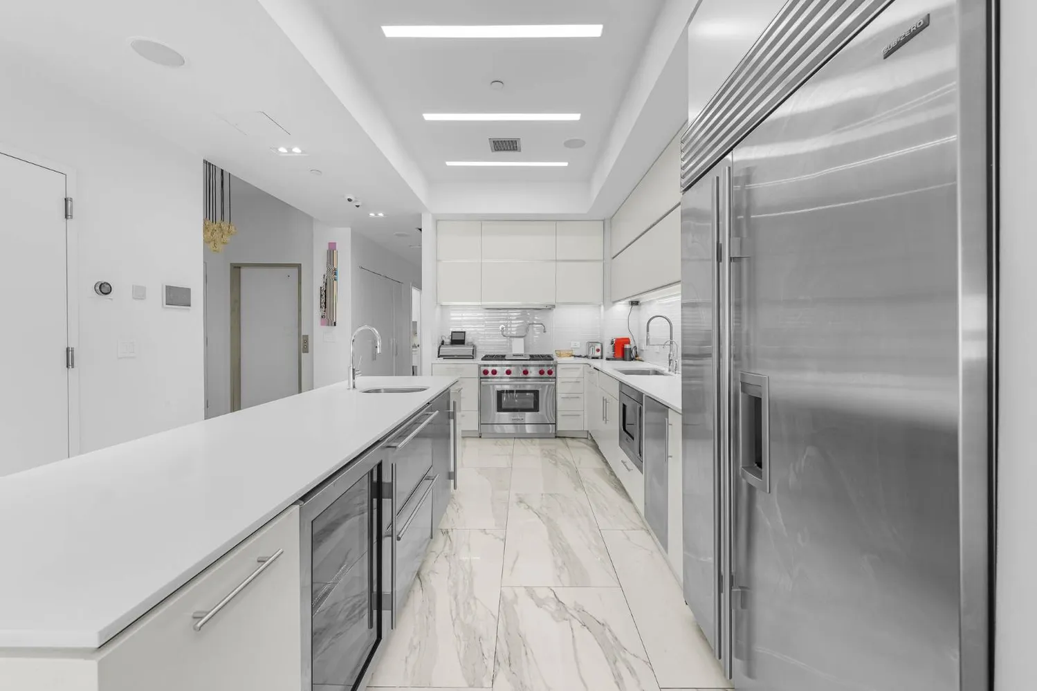 a kitchen with cabinets and wooden floors