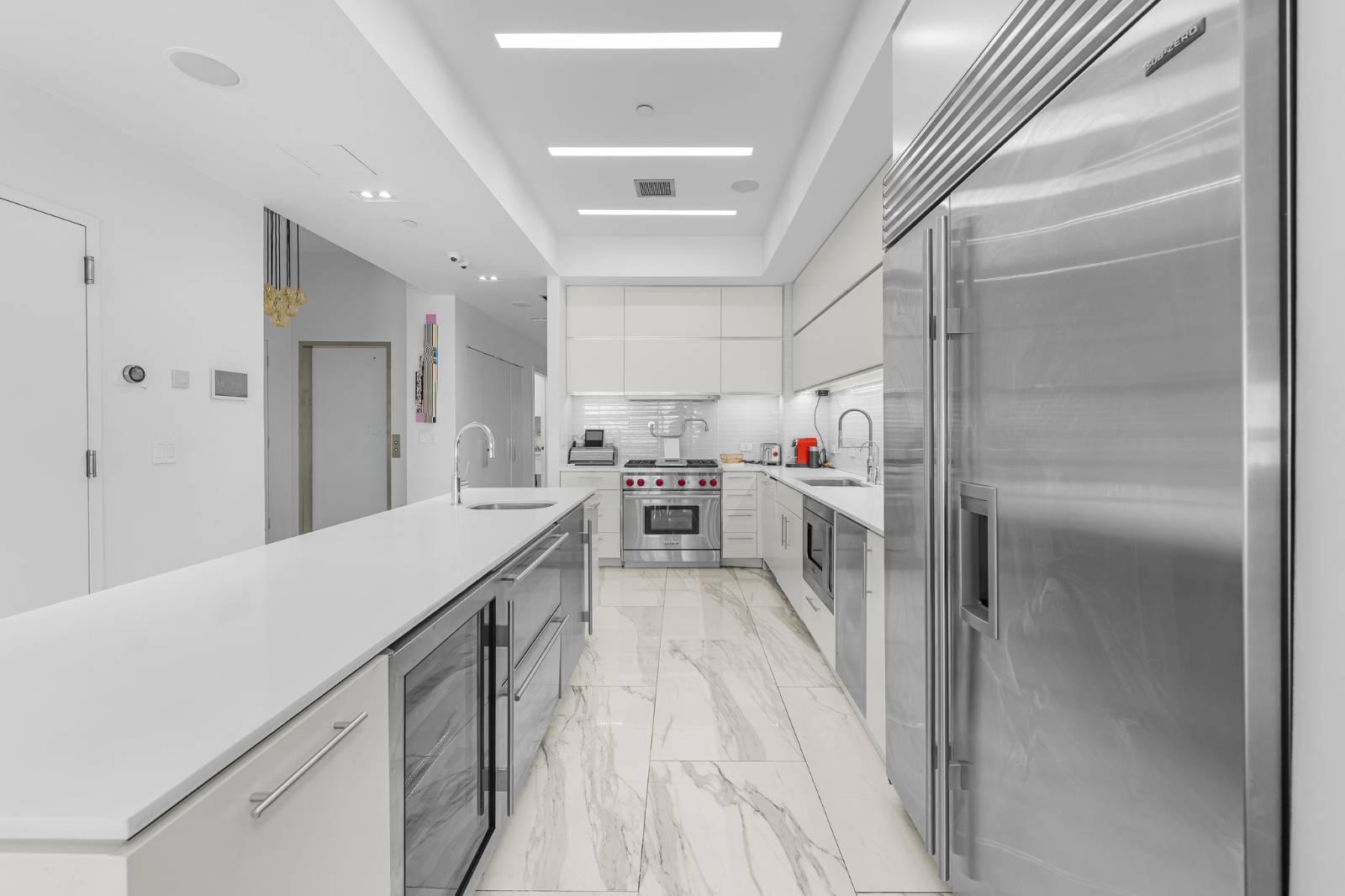 124 East 13th Street, Unit 3 Manhattan, NY 10003 - Photo 9 of 26 a kitchen with cabinets and wooden floors