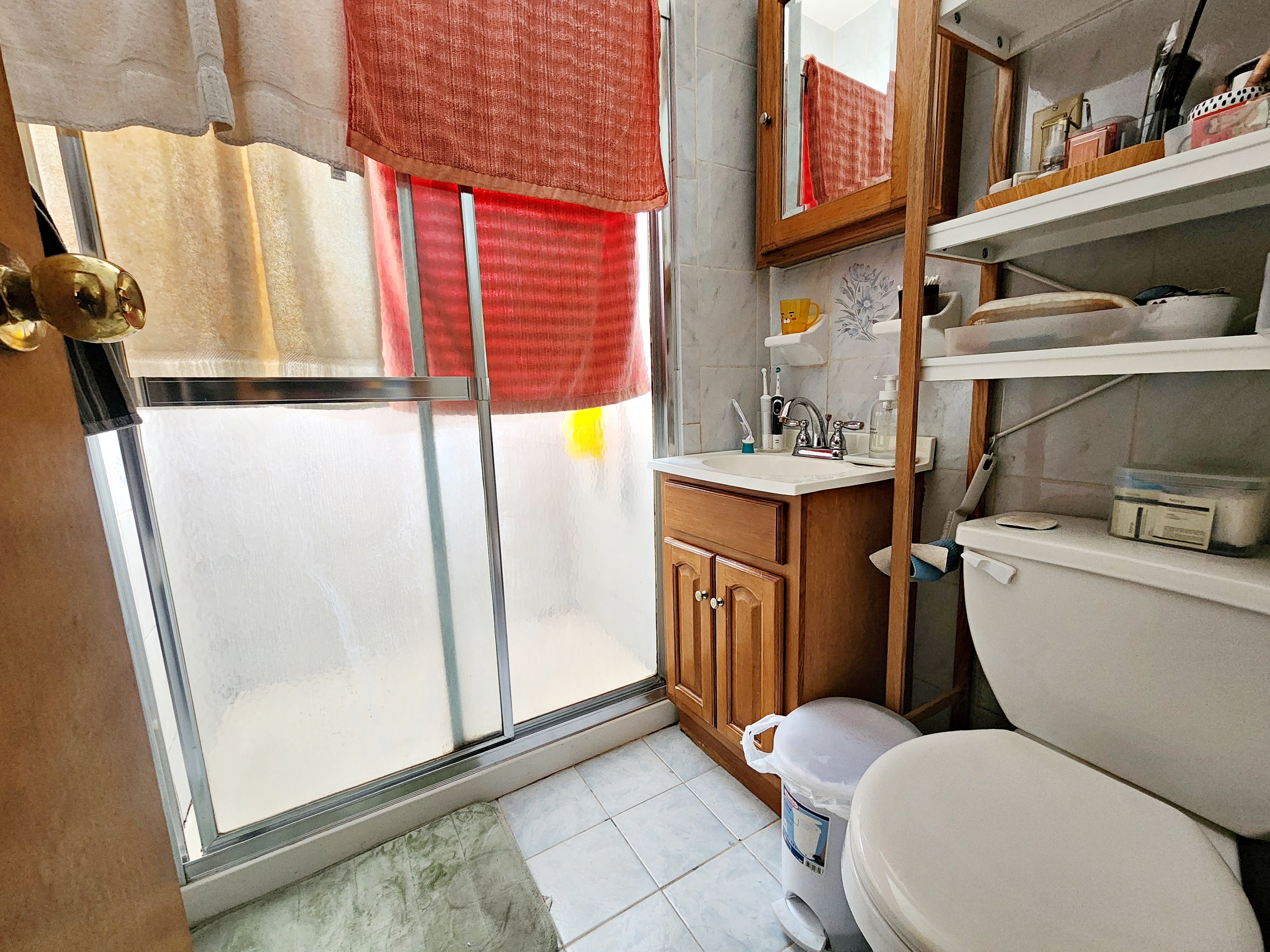 148 Withers Street, Unit 3L Brooklyn, NY 11211 - Photo 6 of 9 a bathroom with a toilet a sink and a shower