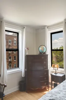 a view of a door and a living room