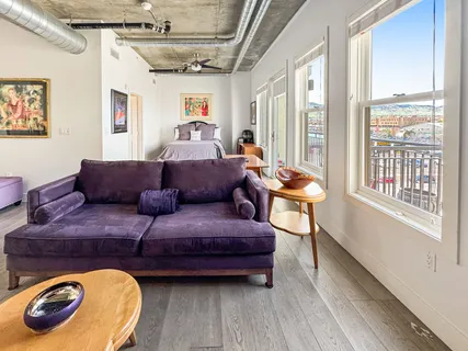 a living room with furniture and a window