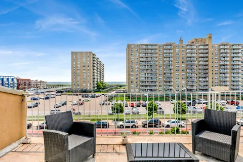 a view of roof with sitting area