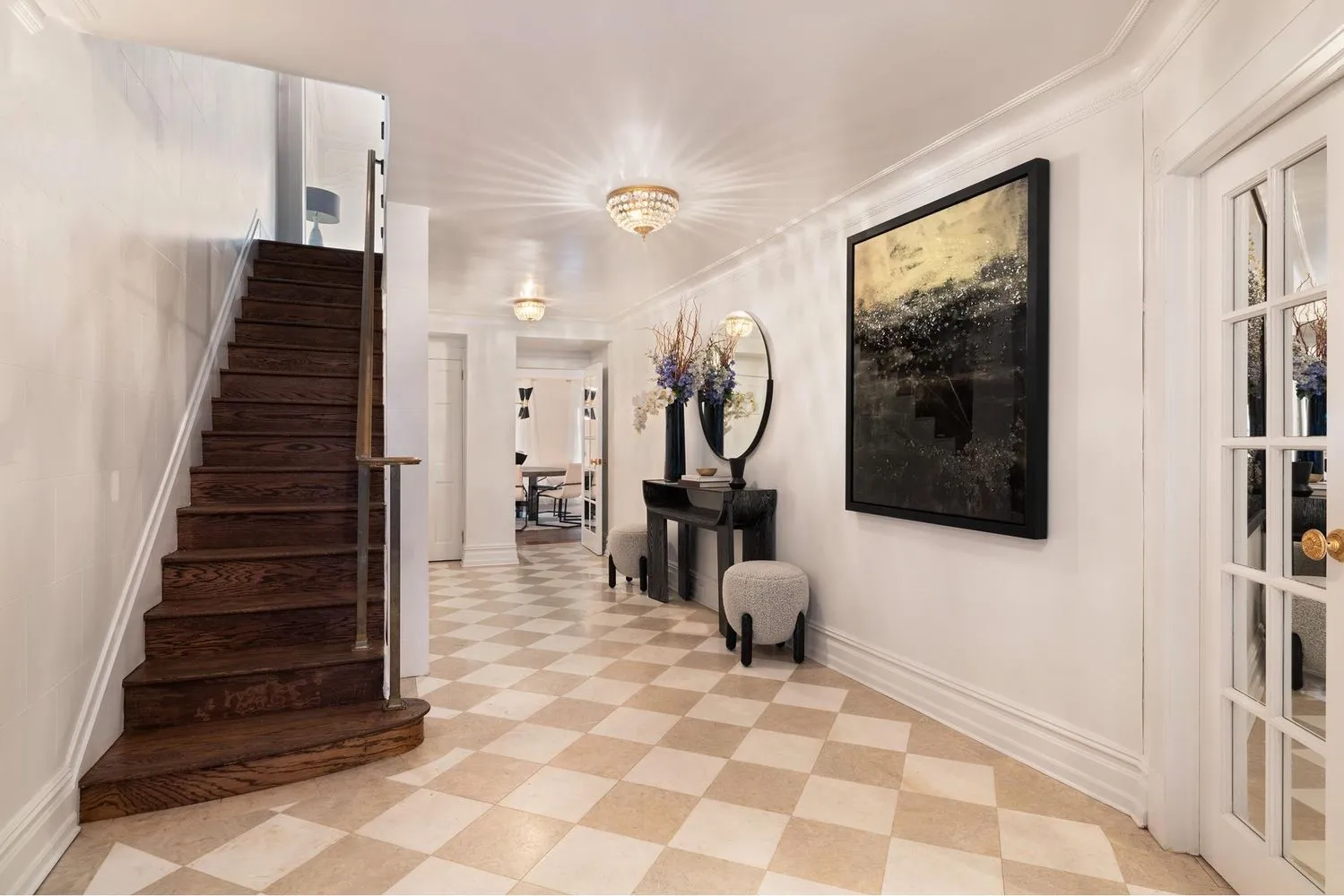 a view of entryway and hall with wooden floor