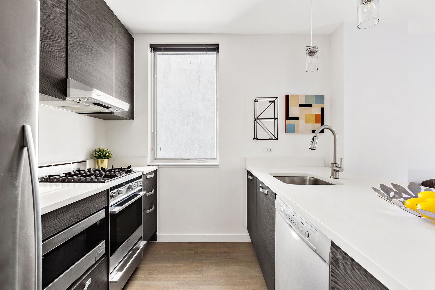 1638 8th Avenue, Unit 1B Brooklyn, NY 11215 - Photo 3 of 12 a kitchen with a stove and a sink