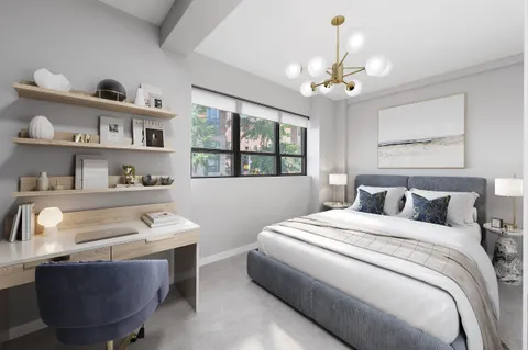 a bedroom with bed and a window