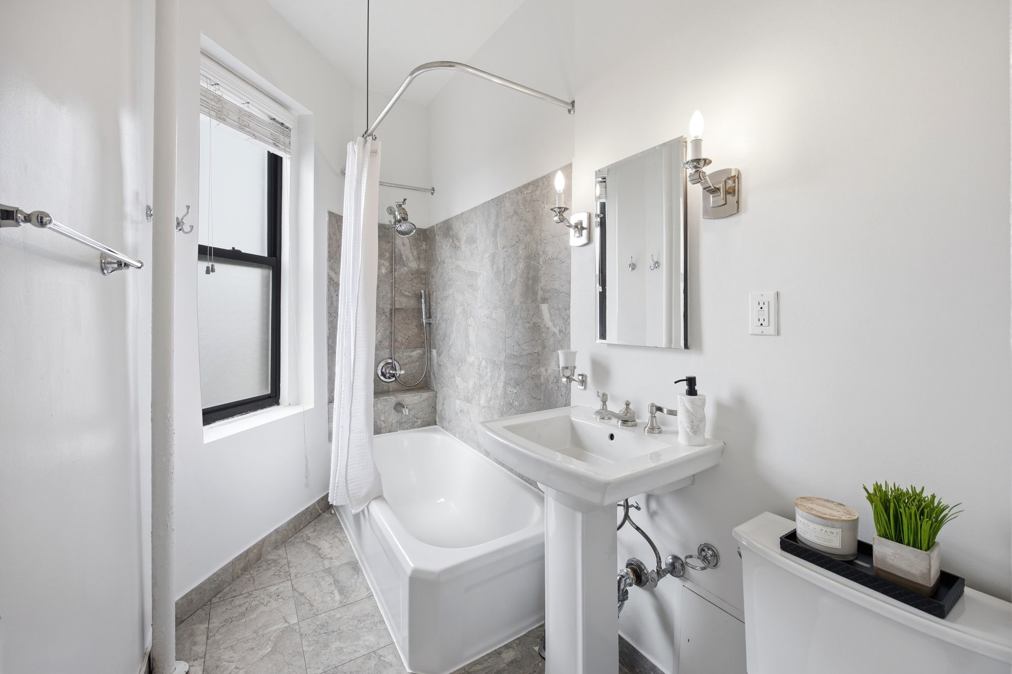 485 Central Park West, Unit 7A Manhattan, NY 10025 - Photo 10 of 15 a bathroom with a sink and a mirror