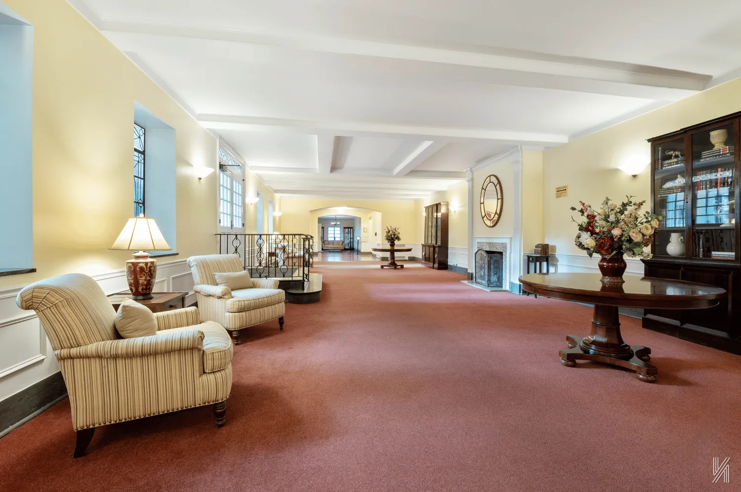 a living room with furniture gym equipment and a large window