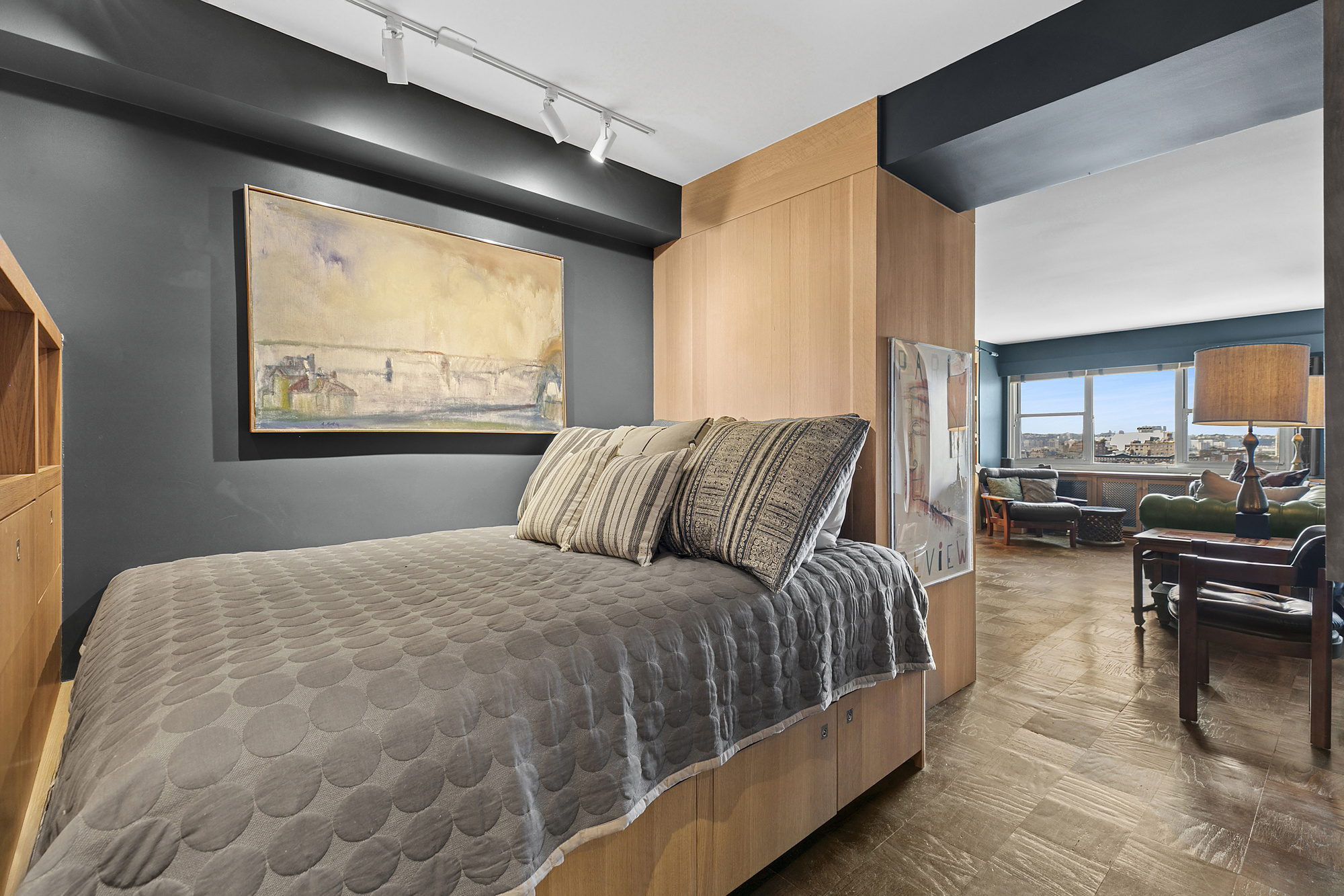 3 Sheridan Square, Unit 15A Manhattan, NY 10014 - Photo 7 of 11 a bedroom with a large bed and a couch