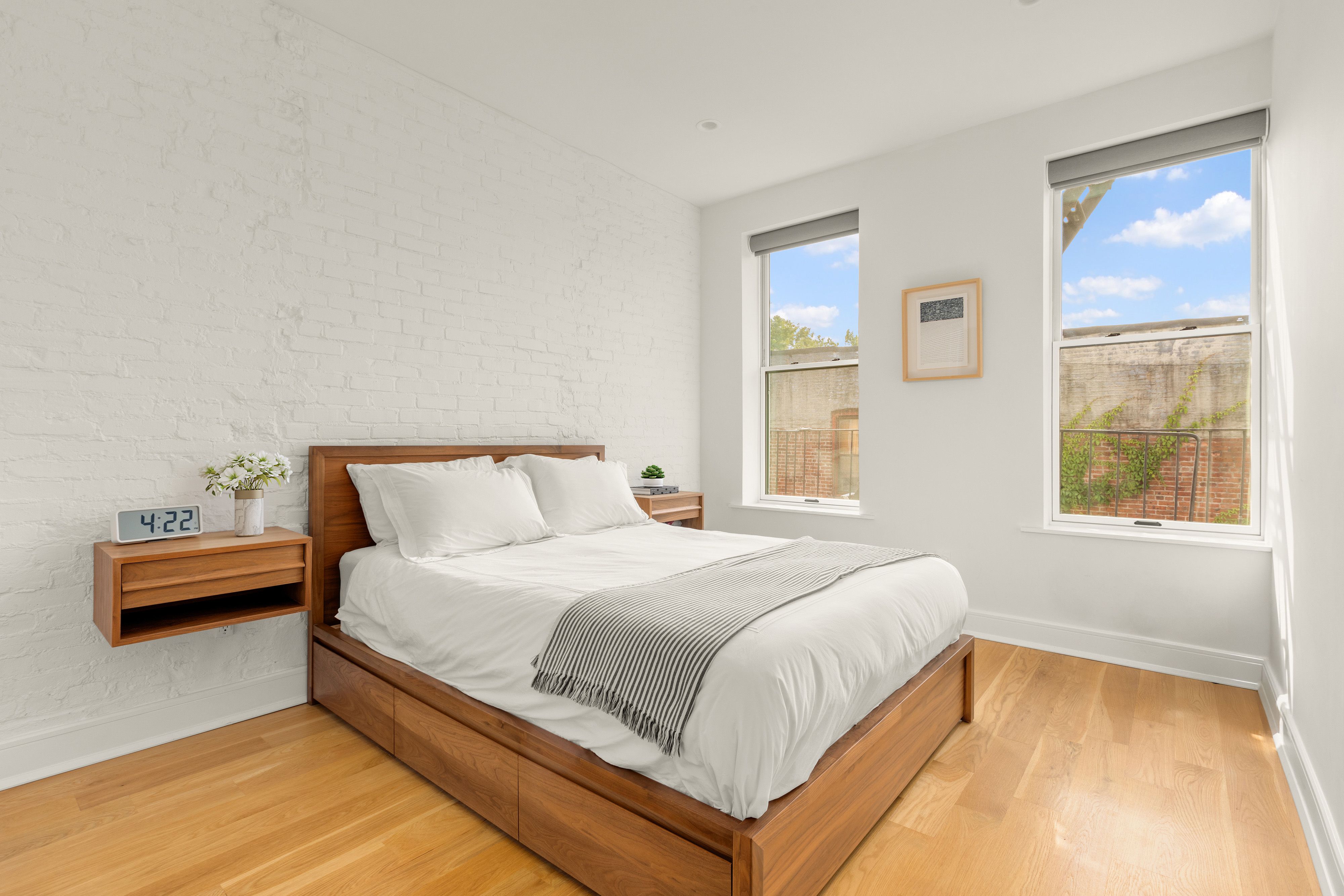 352 6th Avenue, Unit 3 Brooklyn, NY 11215 - Photo 8 of 14 a bedroom with a bed and windows