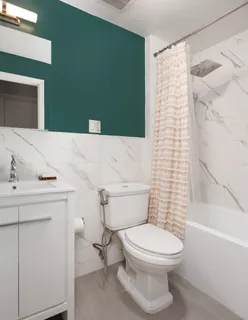 a bathroom with a toilet and a sink