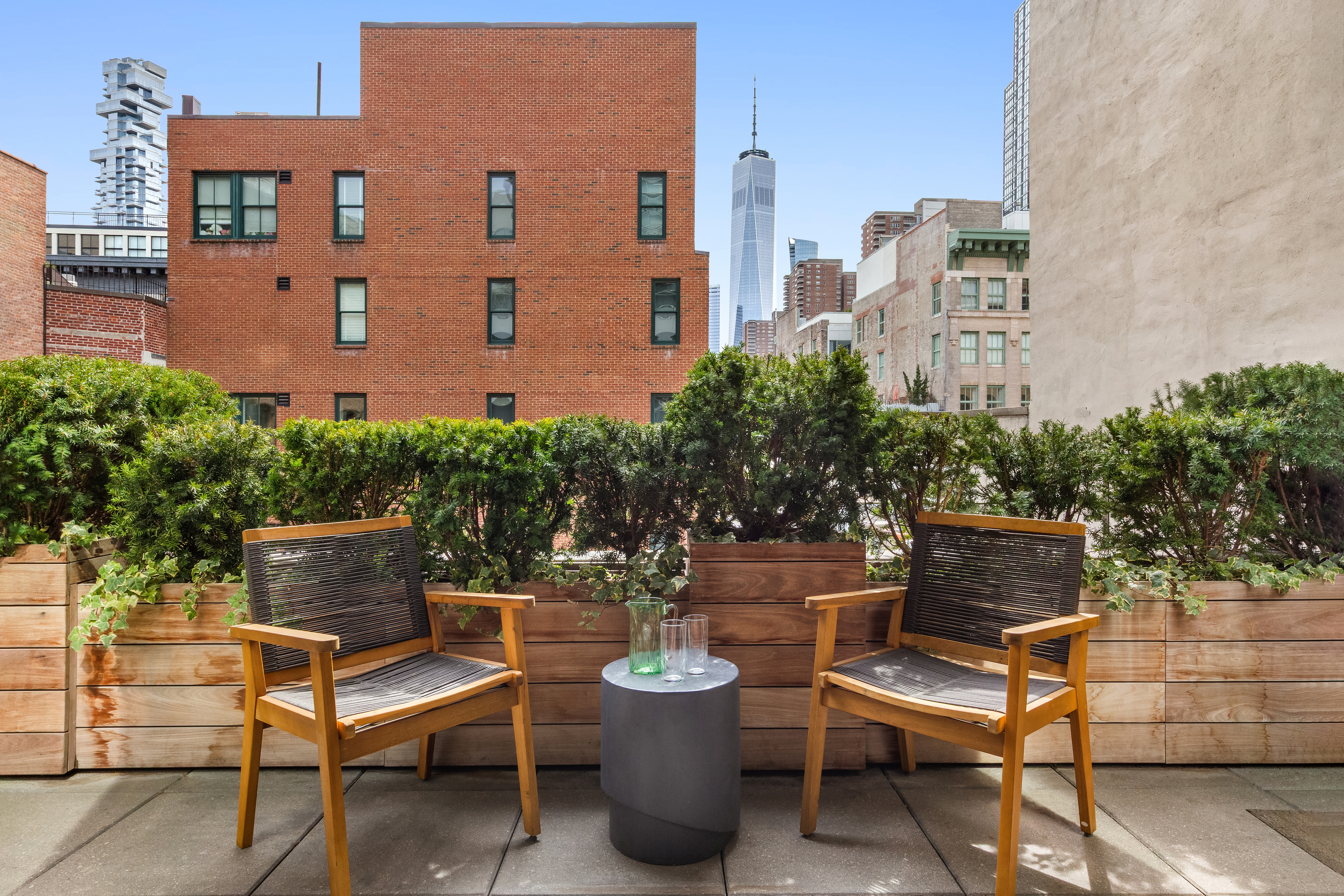 33 Vestry Street Manhattan, NY 10013 - Photo 5 of 16 a view of a chairs and table in a patio