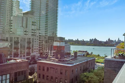 a view of a city with tall buildings