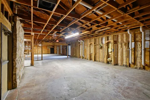 a view of a room with wooden walls