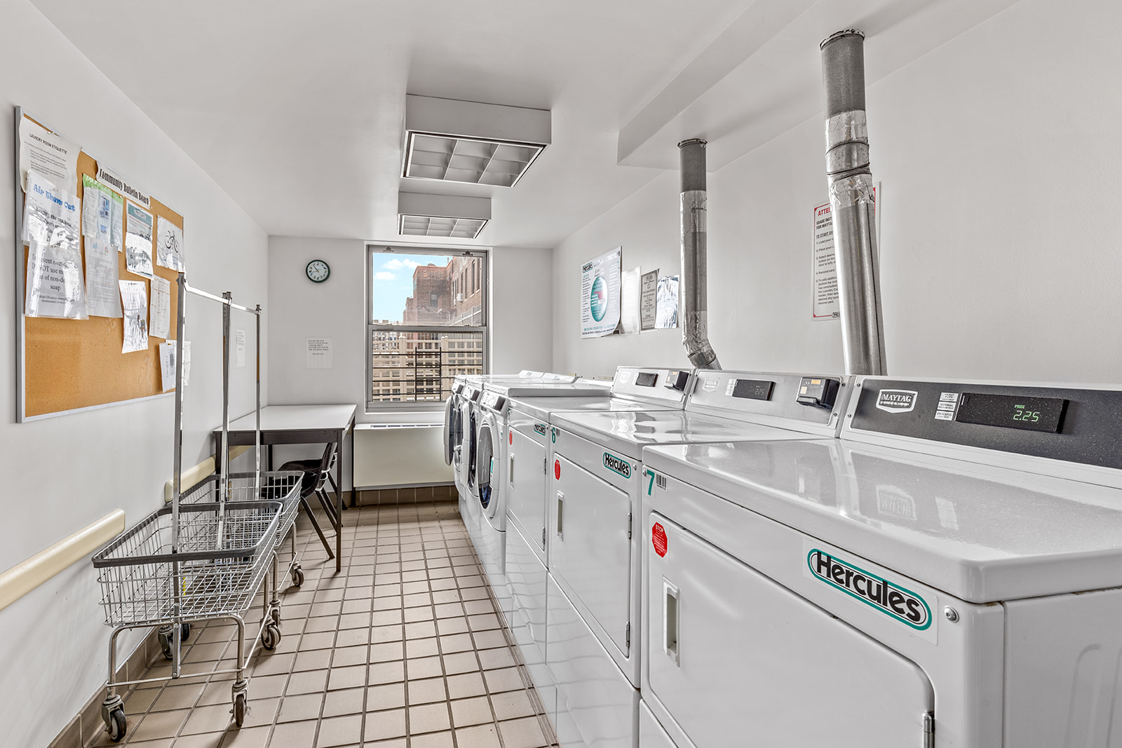 4102 Queens Boulevard, Unit 3D Queens, NY 11104 - Photo 7 of 7 a utility room with a sink a washer and dryer