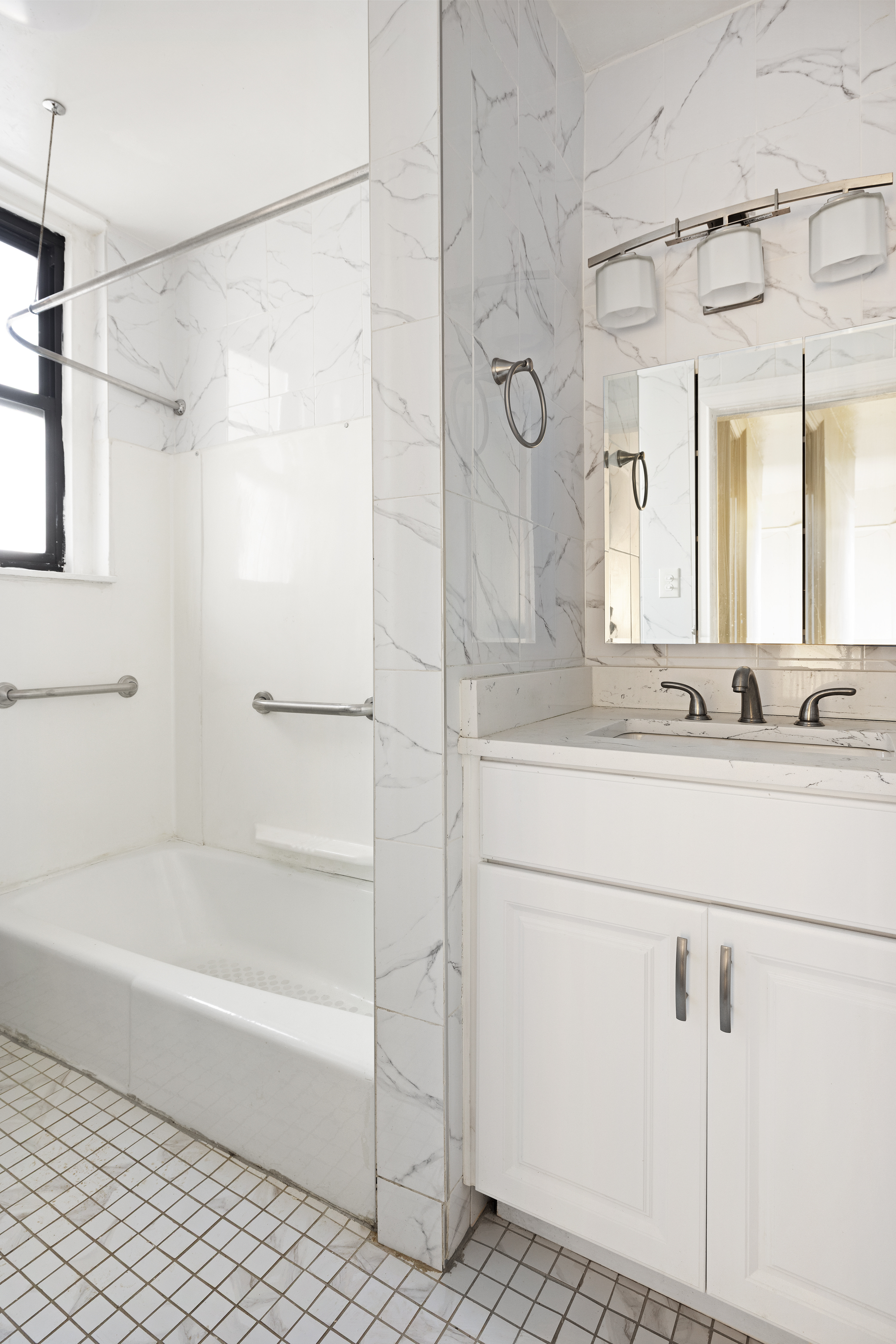421 Crown Street, Unit 18R Brooklyn, NY 11225 - Photo 6 of 8 a bathroom with a shower sink and mirror
