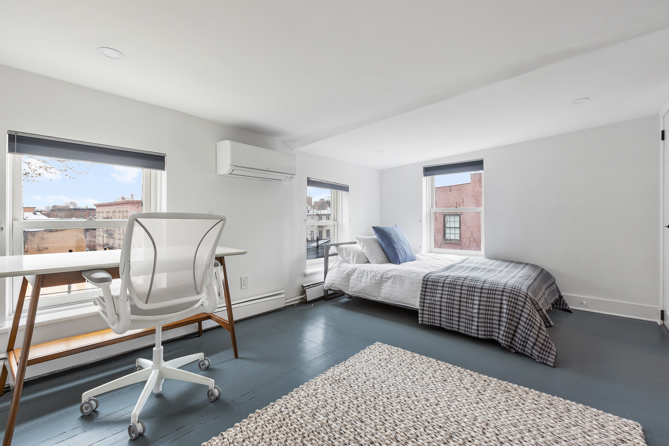 252 Dean Street, Unit 2 Brooklyn, NY 11217 - Photo 7 of 9 a bedroom with a bed and glass walk in closet