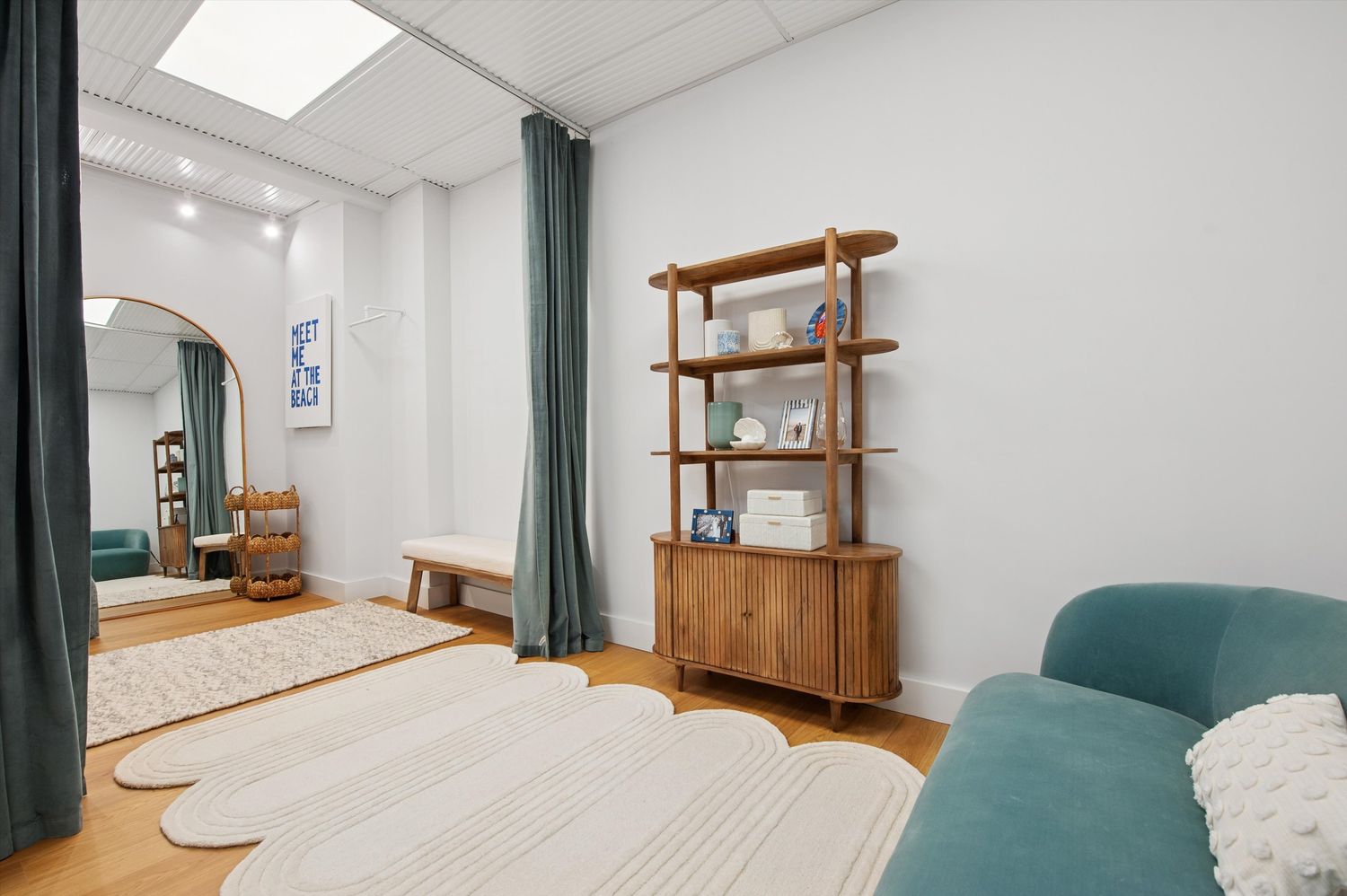 a gym room with furniture and large windows