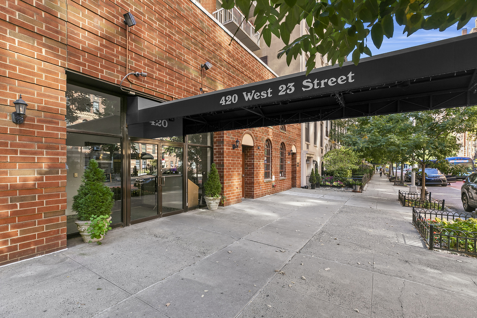420 West 23rd Street, Unit 6B Manhattan, NY 10011 - Photo 9 of 11 a view of a patio with a table and chairs and potted plants