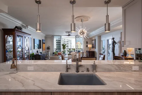 a view of a living room and chandelier