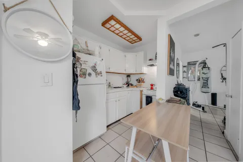 a view of a chairs and table in the patio