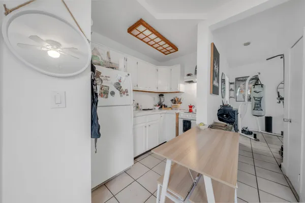 a view of a chairs and table in the patio