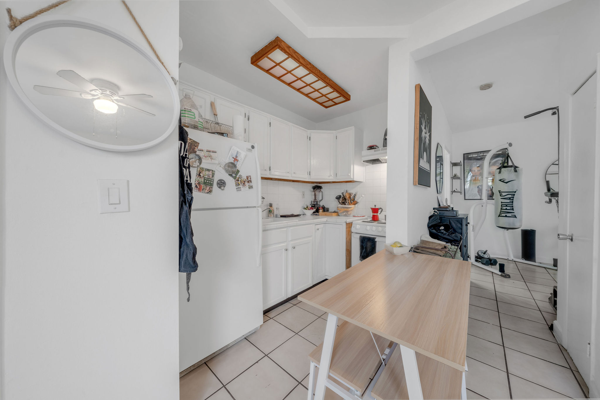 735-745 Meridian Avenue Miami Beach, FL 33139 - Photo 32 of 62 a kitchen with stainless steel appliances cabinets a sink and a refrigerator