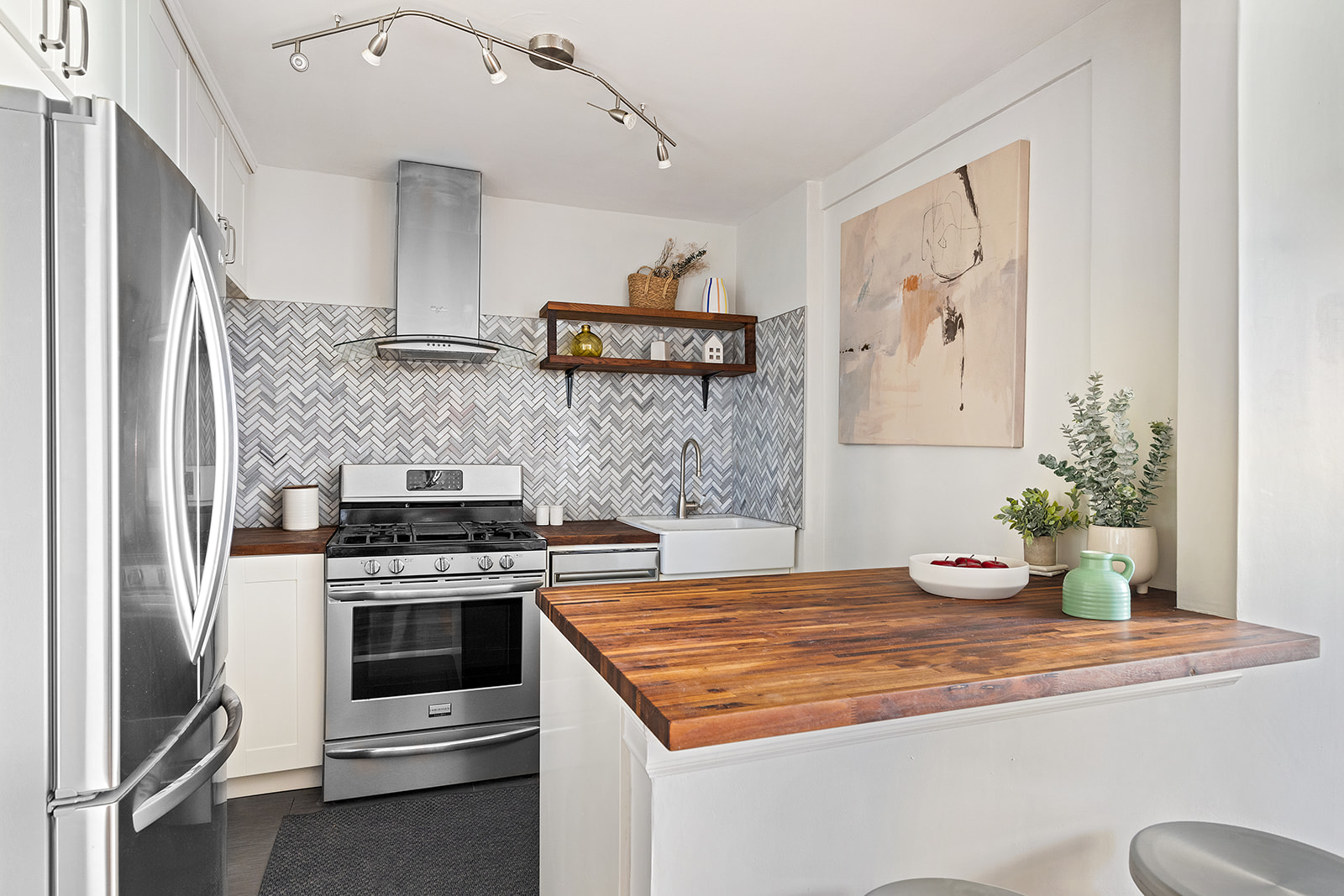 350 Ocean Parkway, Unit 3M Brooklyn, NY 11218 - Photo 3 of 10 a kitchen with stainless steel appliances a stove a refrigerator and cabinets
