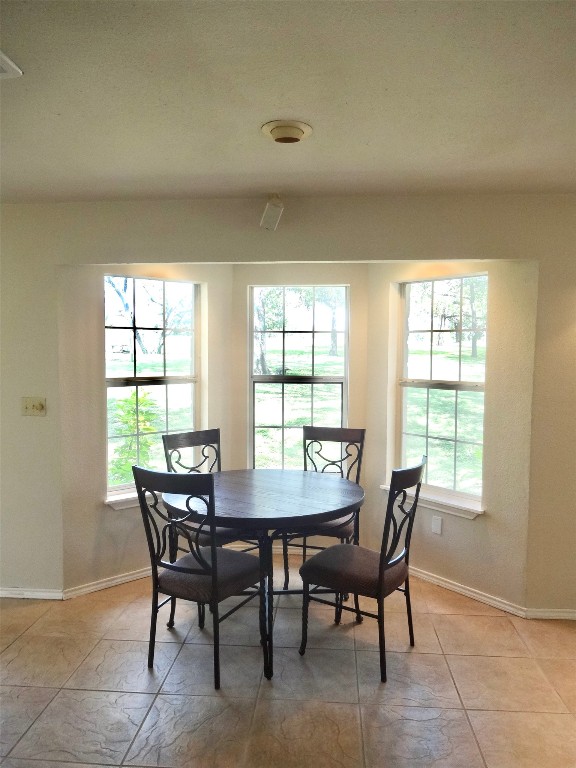 111 Trinity Street Cedar Creek, TX 78612 - Photo 36 of 38 a view of a dining room with furniture and window
