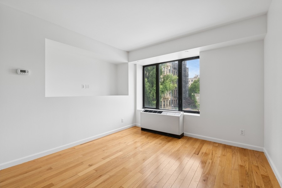 189 Avenue C, Unit 4D Manhattan, NY 10009 - Photo 7 of 17 an empty room with a window