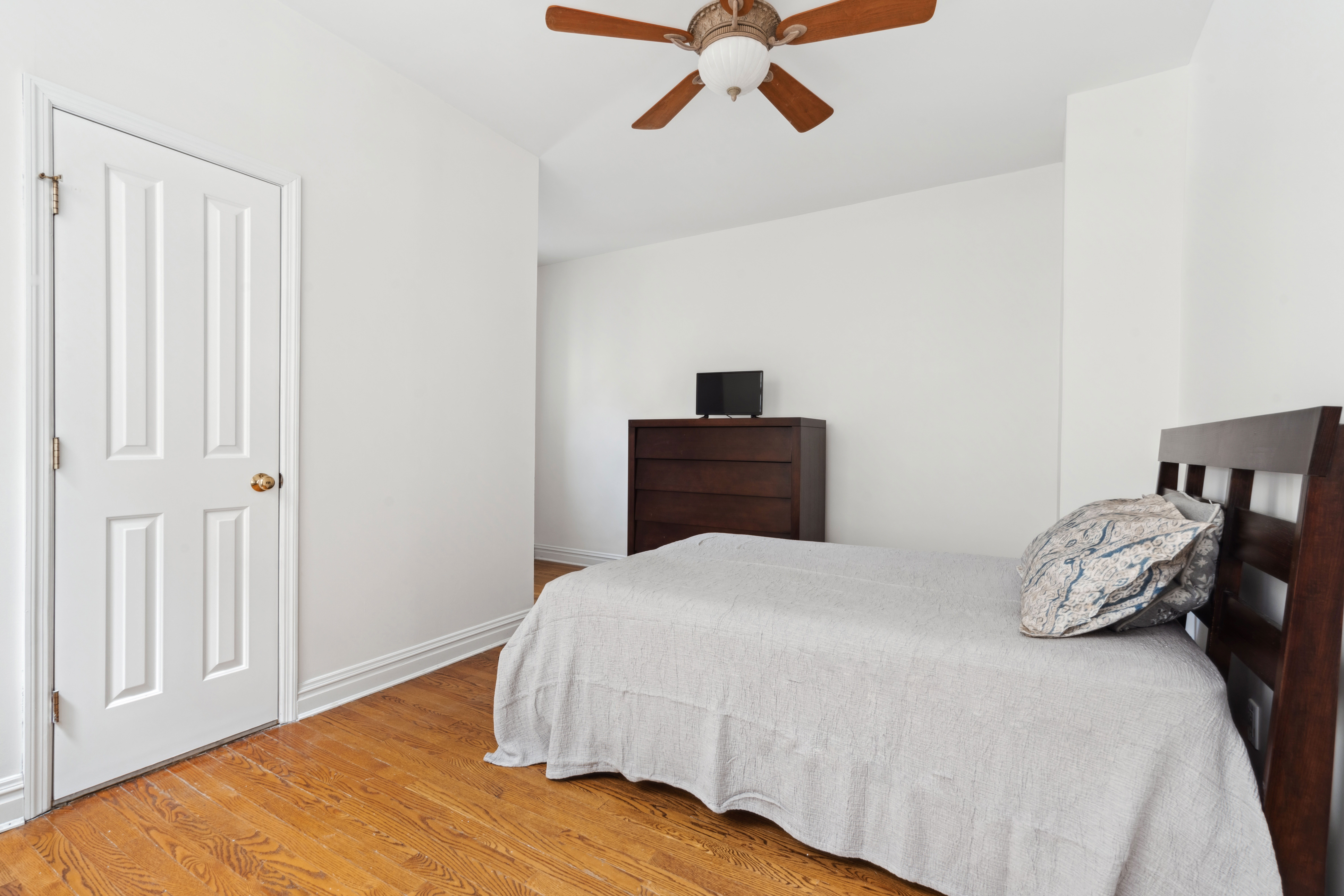 380 Riverside Drive, Unit 7B Manhattan, NY 10025 - Photo 6 of 12 a bedroom with a bed and cabinets