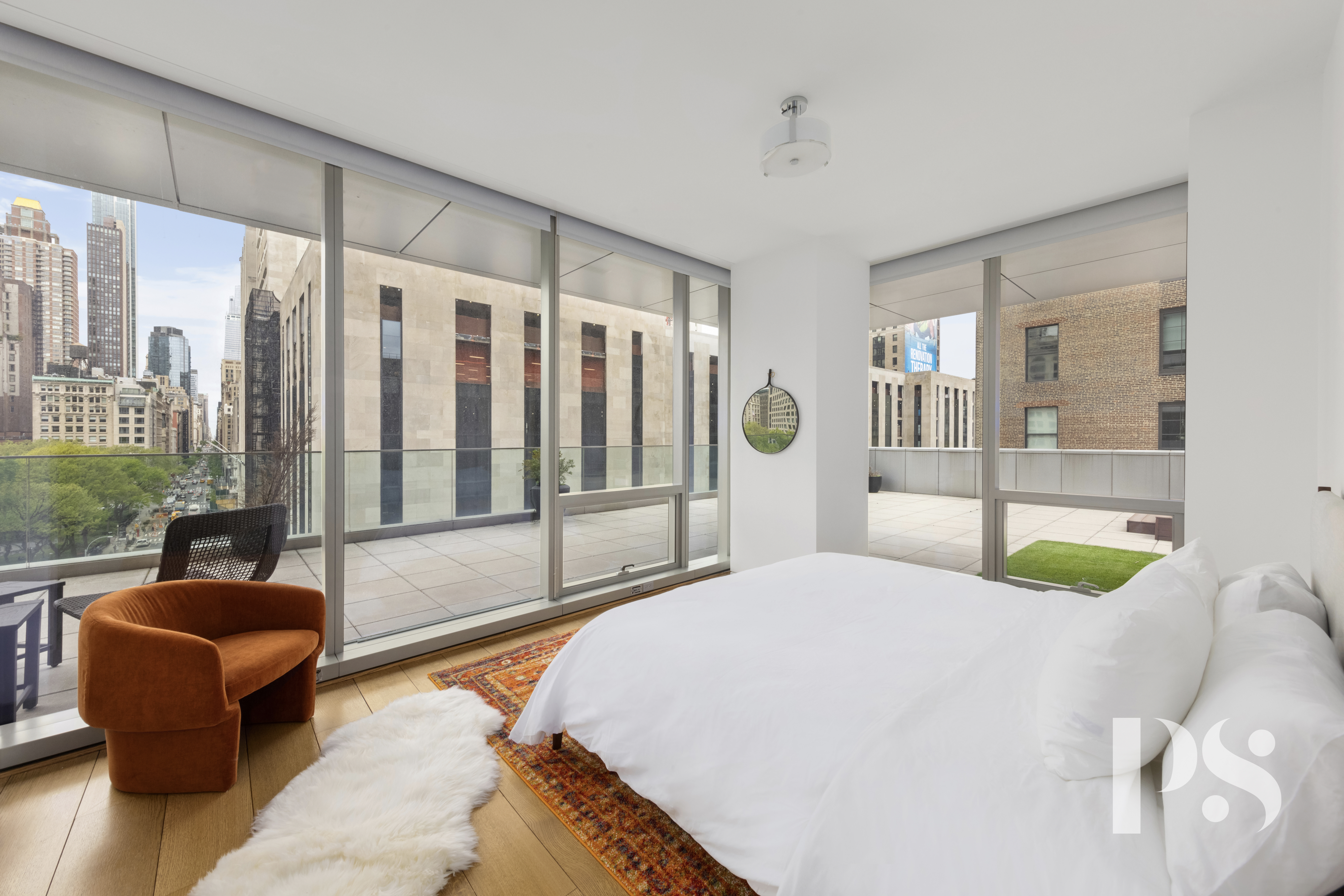 23 East 22nd Street, Unit 8A Manhattan, NY 10010 - Photo 9 of 25 a bedroom with a bed and glass window