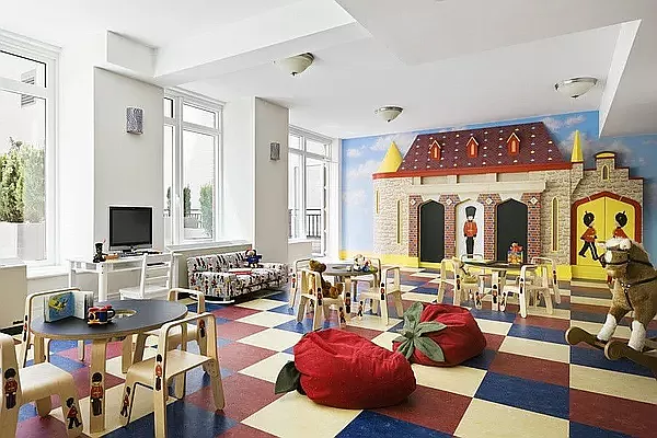 205 East 85th Street, Unit G10 Manhattan, NY 10028 - Photo 22 of 27 a living room with fireplace furniture and a flat screen tv