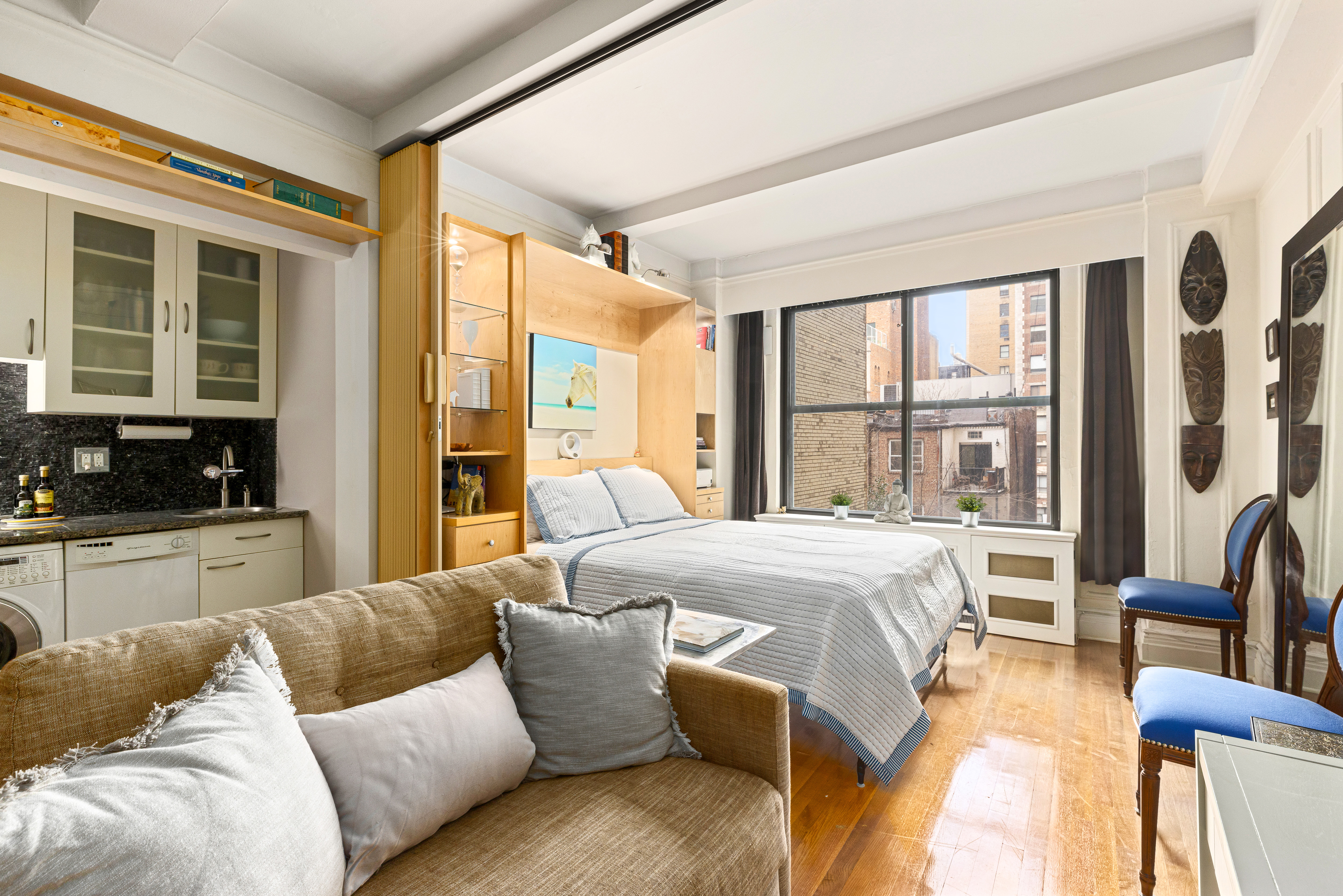 225 Central Park West, Unit 416 Manhattan, NY 10024 - Photo 3 of 16 a bedroom with a large bed and a large window
