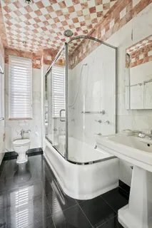 a bathroom with a bathtub and a sink